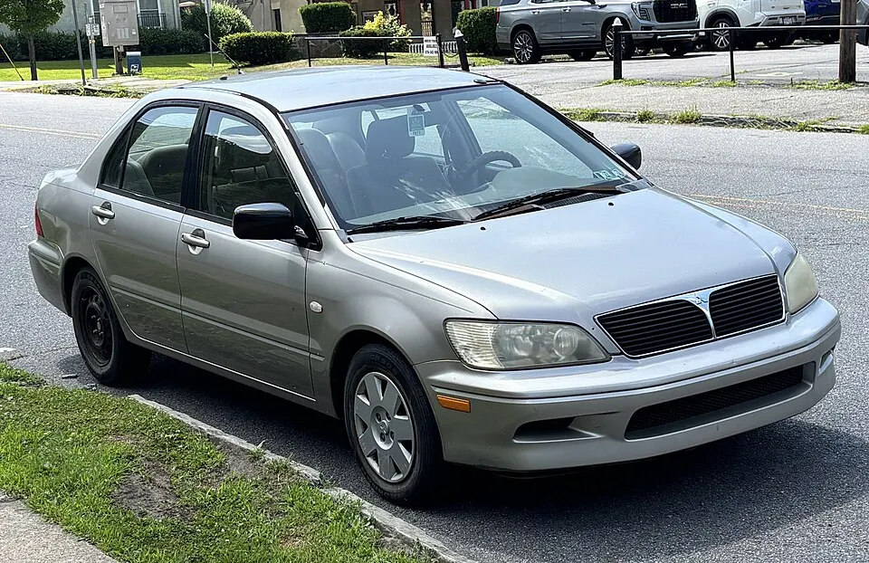 2002 Mitsubishi Lancer ES in Munich Silver Metallic, front right, 07-02-2026, photographed in United States
