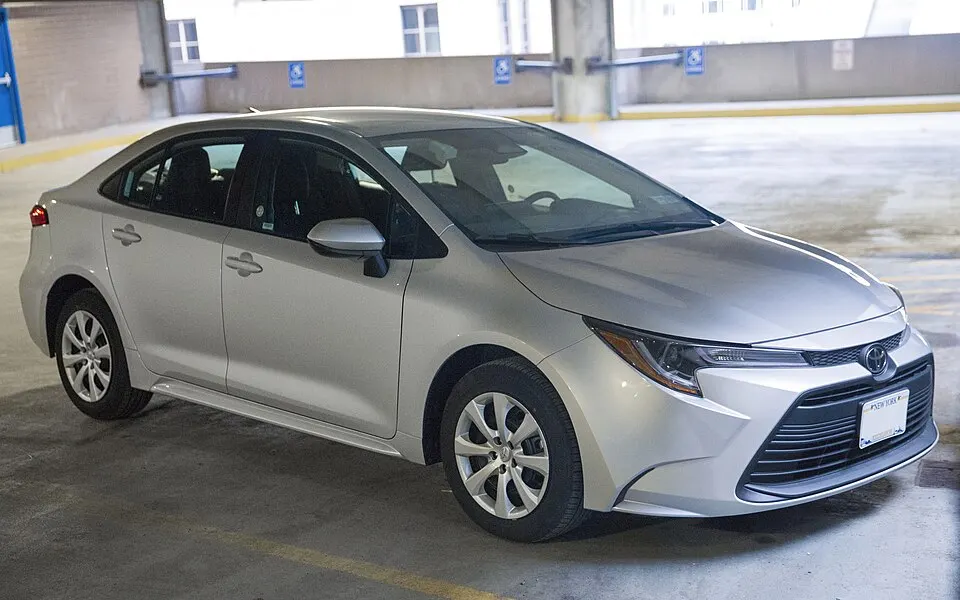 2024 Toyota Corolla LE in Classic Silver Metallic, front right, photographed in United States