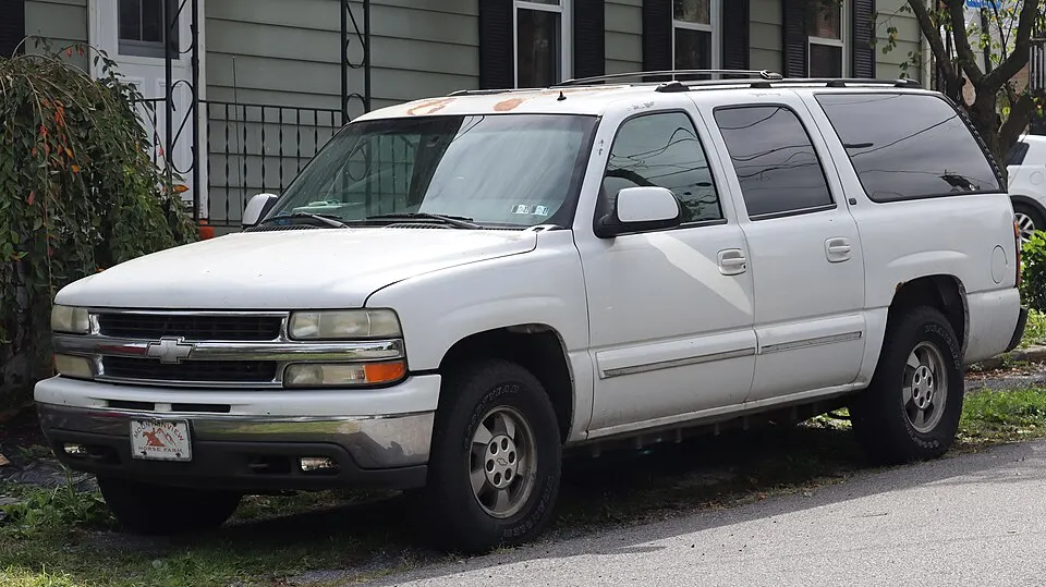 2002 Chevrolet Suburban 1500 LS in Summit White, front left, 09-19-2026, photographed in United States