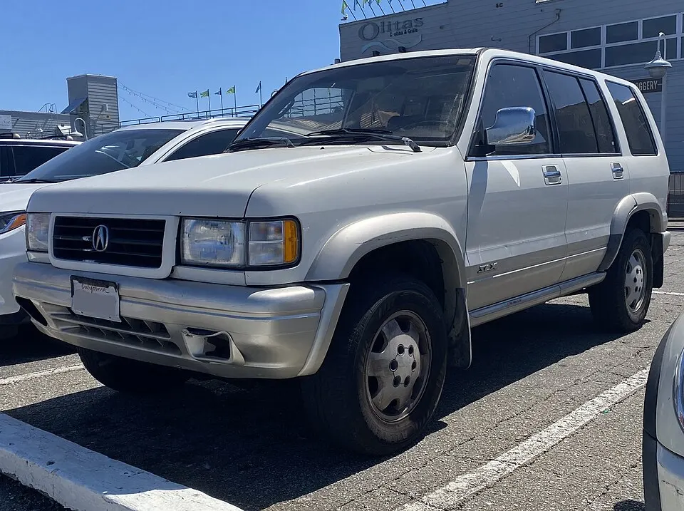 1997 Acura SLX in Cream White-Light Silver Metallic, front left, 08-15-2022, photographed in United States