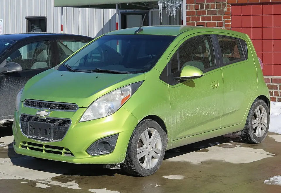 2013 Chevrolet Spark in Jalapeno, front left, 02-08-2026, photographed in United States