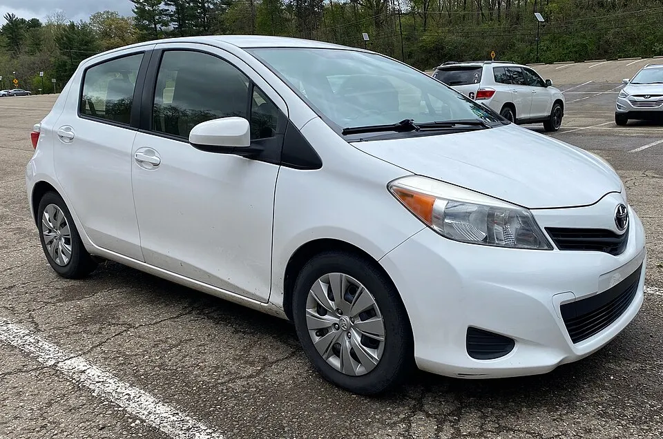 2013 Toyota Yaris LE in Super White, front right, 5-7-2022, photographed in United States