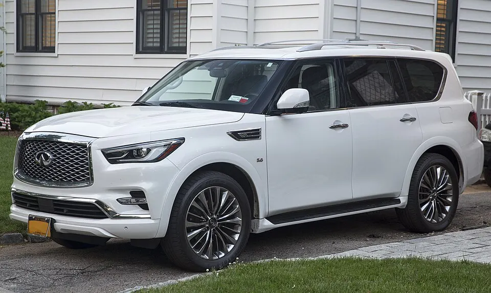 2019 Infiniti QX80 Limited in Moonstone White, front left, photographed in United States