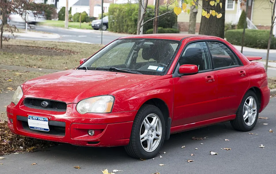 2004 Subaru Impreza 2.5 RS sedan in San Remo Red, front left, photographed in United States