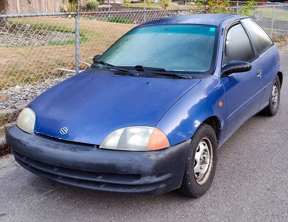 1998 Suzuki Swift GA in Medium Blue Metallic front three quarters, photographed in United States
