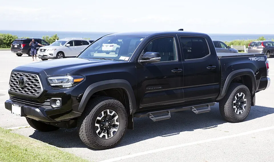 2023 Toyota Tacoma TRD Off-Road Double Cab in Black, front left, photographed in United States