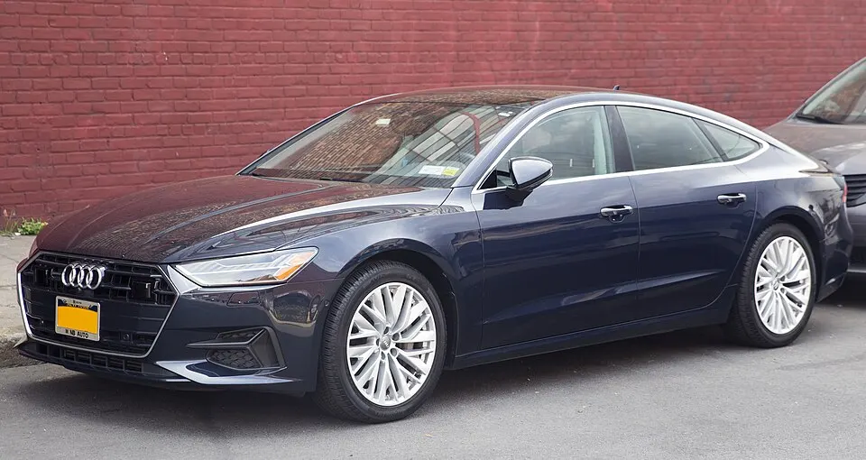 2019 Audi A7 3.0 quattro Premium Plus in Brilliant Black, front left, photographed in United States