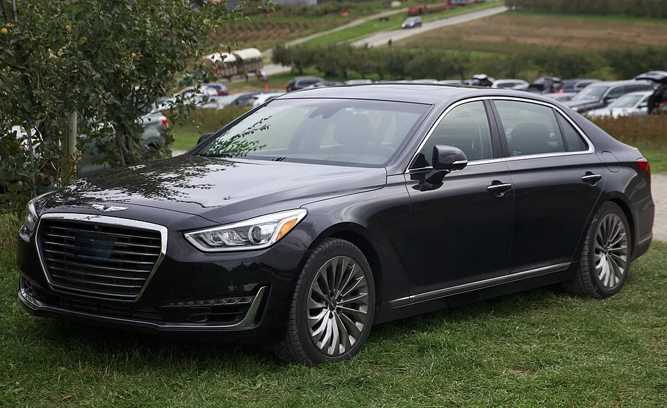 2019 Genesis G90 3.3T Premium in Victoria Black, front left, photographed in United States