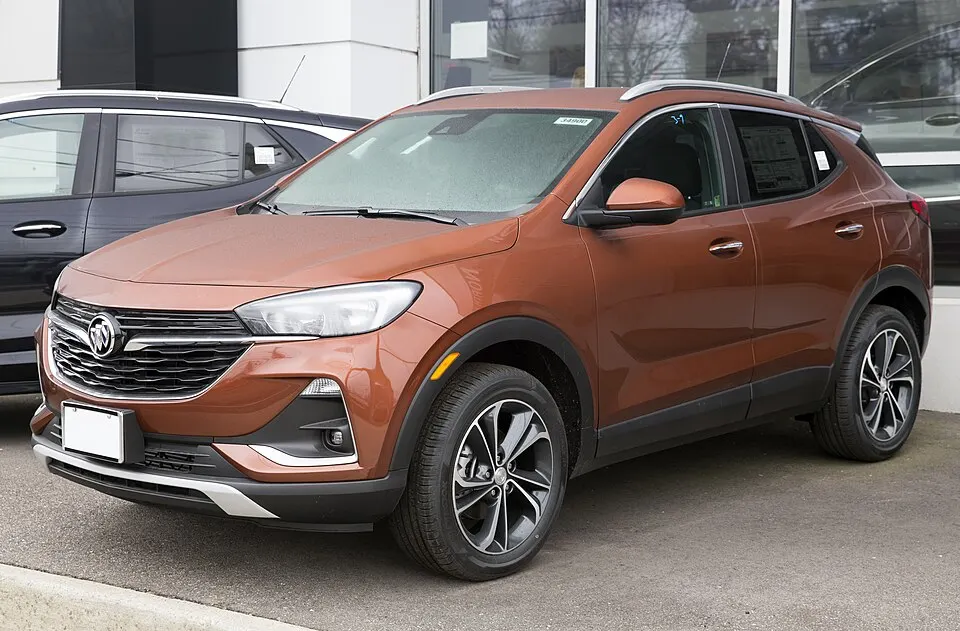 2021 Buick Encore GX Select AWD in Burnished Bronze metallic, front left, photographed in United States