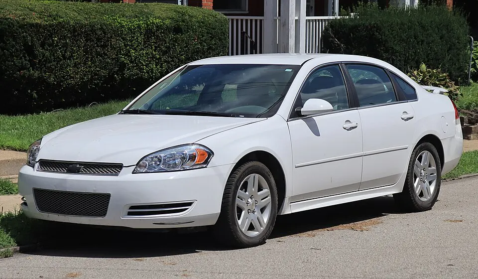 2012 Chevrolet Impala LT in Summit White, front left, 08-09-2026, photographed in United States