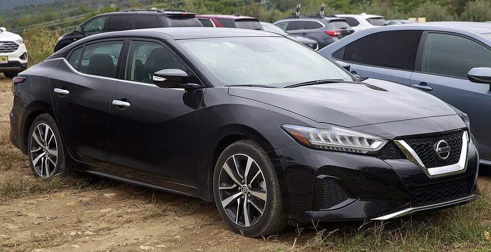 2021 Nissan Maxima SV in Super Black, front right (2), photographed in United States