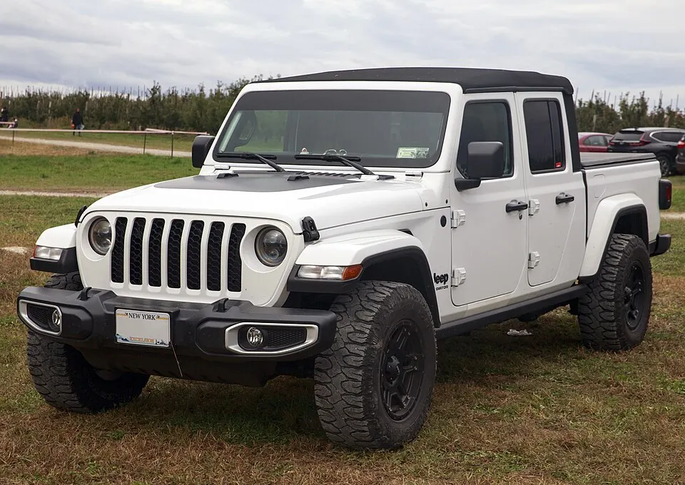2021 Jeep Gladiator Sport in Bright White, front left, photographed in United States