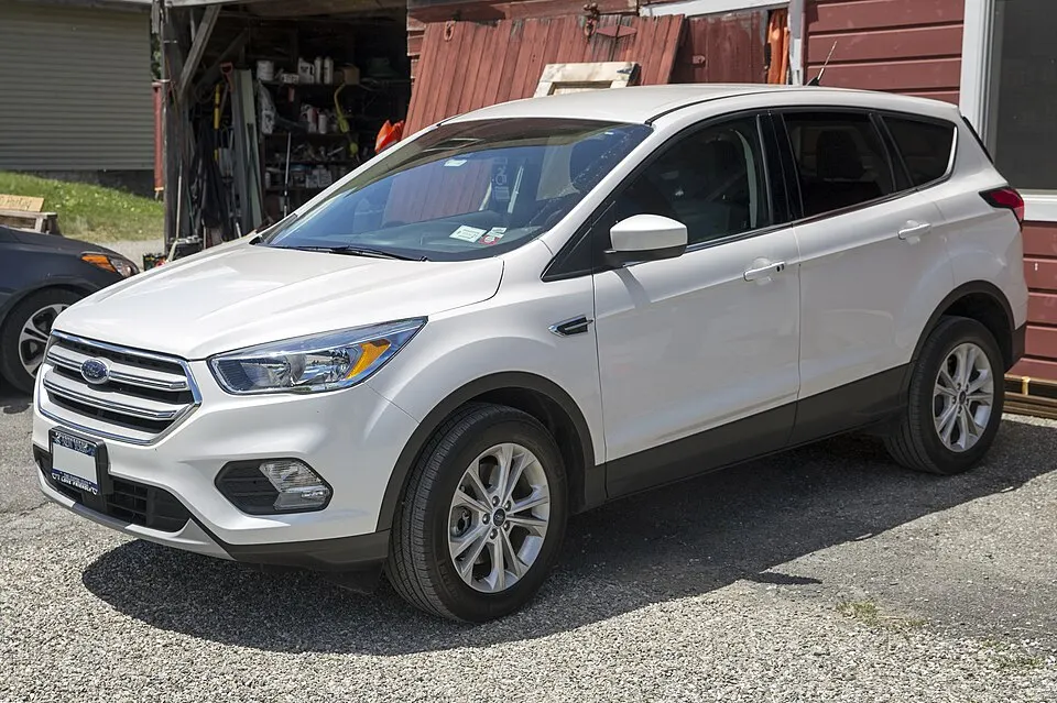 2019 Ford Escape SE in White, front left, photographed in United States