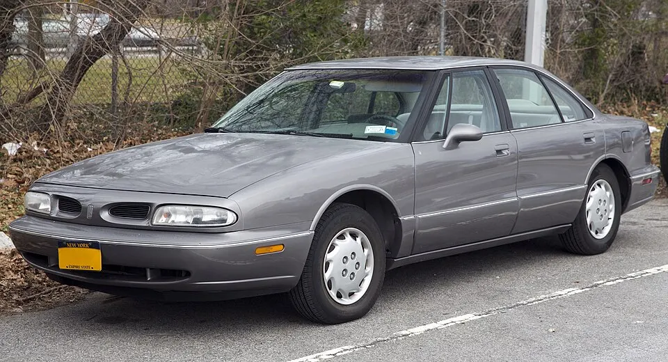 1996 Oldsmobile Eighty Eight LS in Light Gray Metallic, front left, photographed in United States