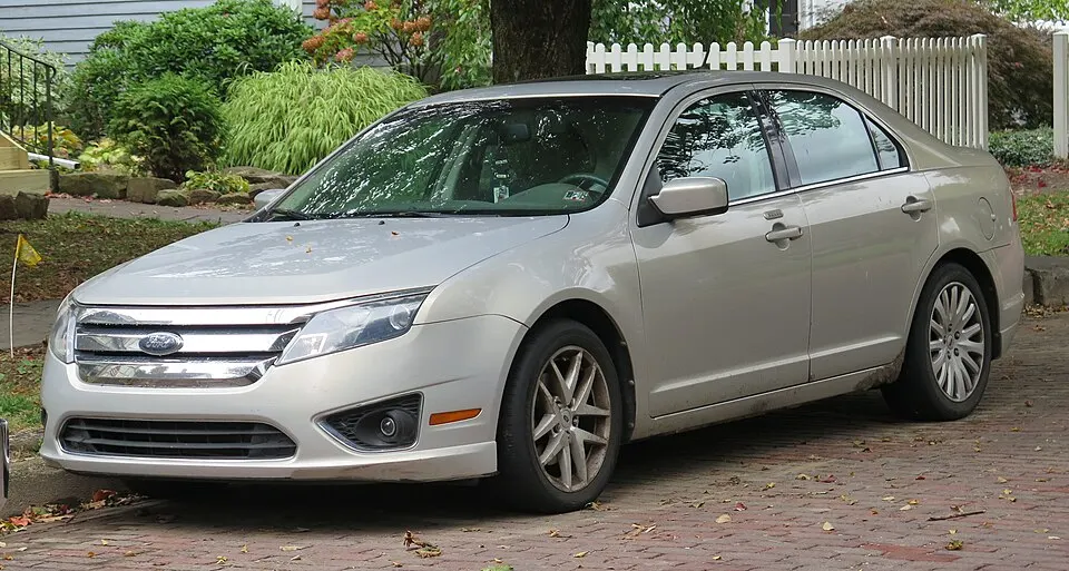 2010 Ford Fusion in Smokestone Metallic, front left, 10-12-2025, photographed in United States