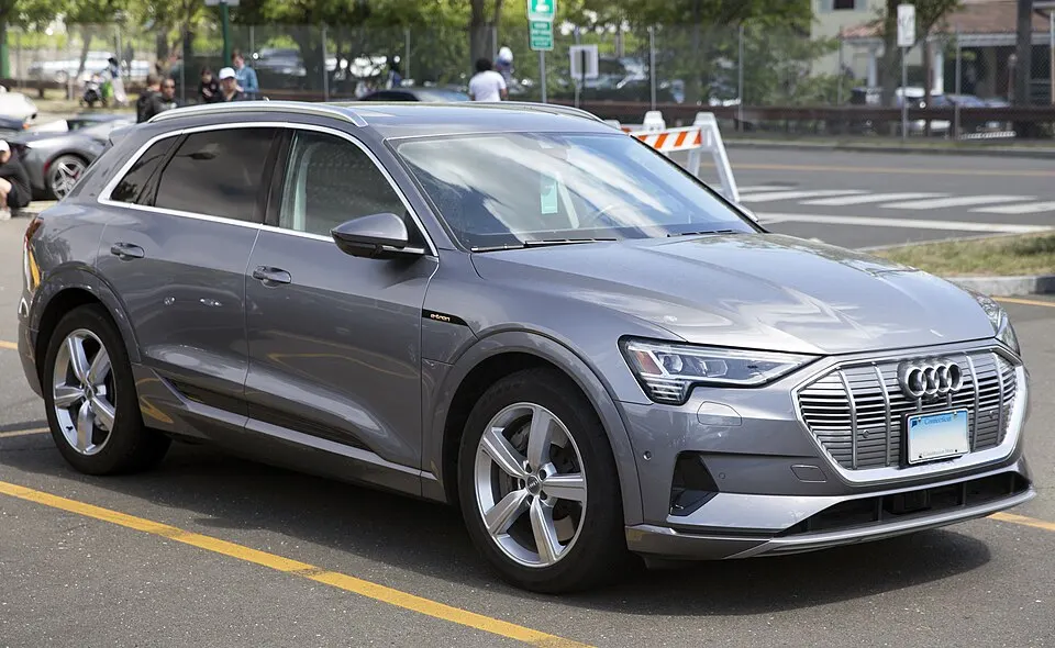2019 Audi e-tron Prestige quattro in Typhoon Gray Metallic, front right, photographed in United States
