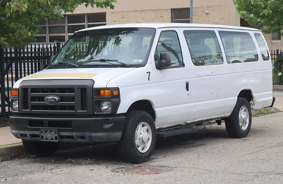 2011 Ford E-250 Extended in Oxford White, front left, 05-23-2026, photographed in United States
