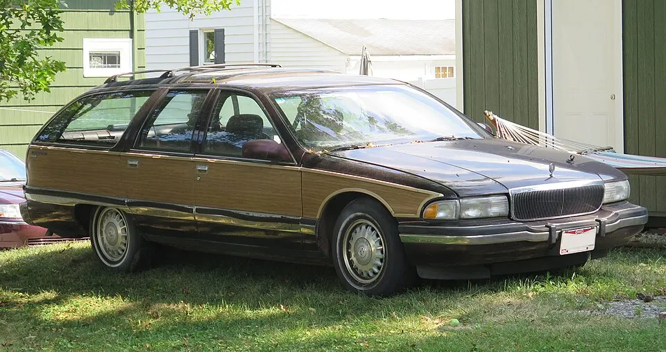 1996 Buick Roadmaster Estate in Ruby Red Metallic, front right, 08-16-2025, photographed in United States
