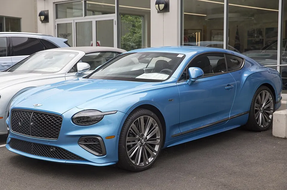 2025 Bentley Continental GT Speed Coupé in Kingfisher, front left, photographed in United States