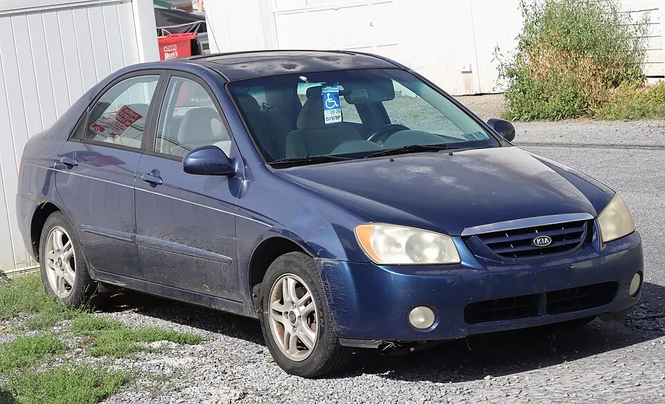 2004 Kia Spectra EX in Imperial Blue, front right, 09-19-2026, photographed in United States