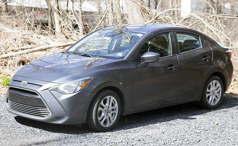 2018 Toyota Yaris iA in Graphite Mica, front left, photographed in United States