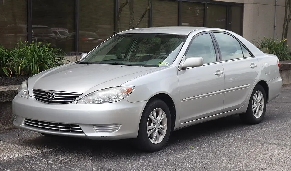 2005 Toyota Camry LE V6 in Lunar Mist Metallic, front left, 06-06-2026, photographed in United States