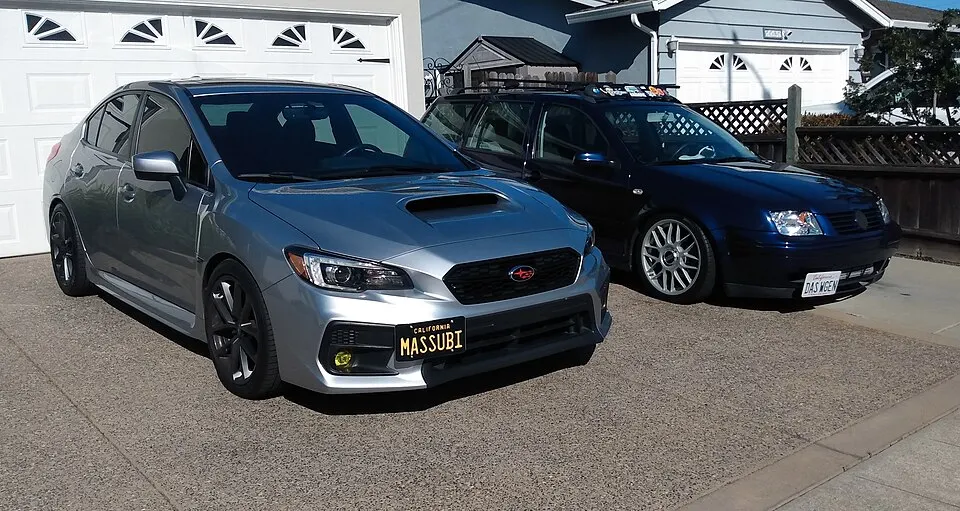 2017 Subaru WRX & 2003 Volkswagen Jetta, photographed in United States