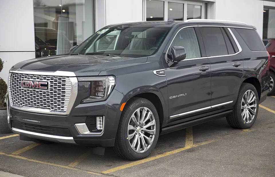 2021 GMC Yukon Denali in Hunter Metallic, front left, photographed in United States