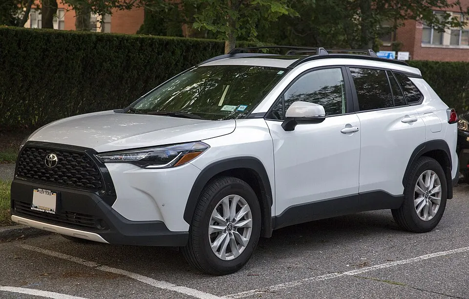 2024 Toyota Corolla Cross LE AWD in Wind Chill Pearl, front left, photographed in United States