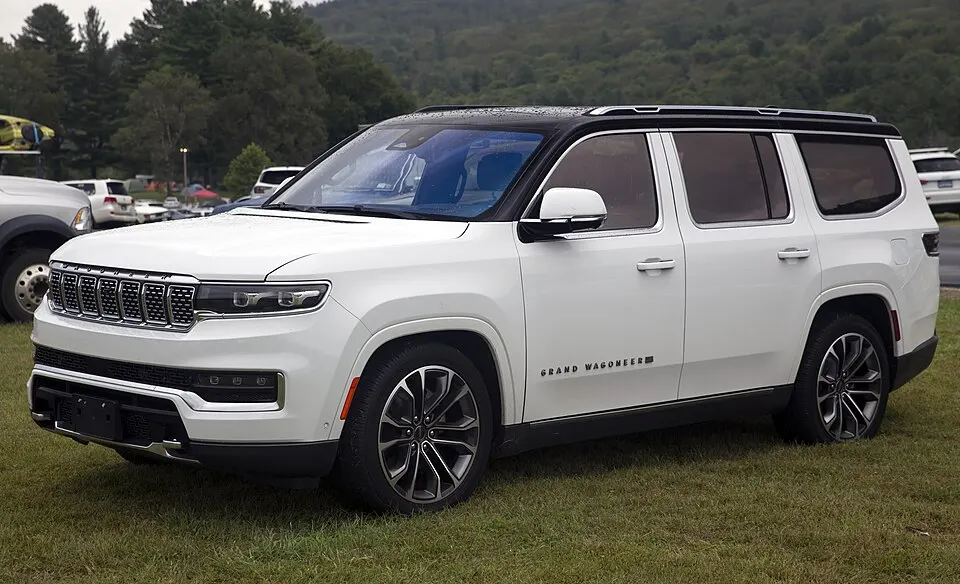 2022 Jeep Grand Wagoneer Series III in Bright White and Black, front left, photographed in United States