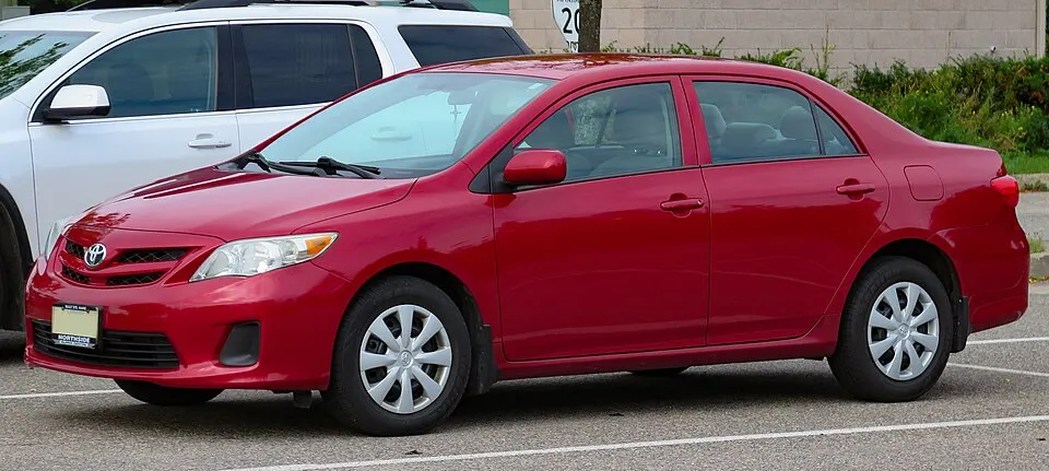 2013 Toyota Corolla CE Convenience Package in Barcelona Red Metallic, Front Left, 08-22-2023, photographed in Canada