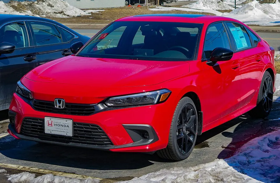 2023 Honda Civic Sport Sedan in Rallye Red, Front Left, 04-07-2023, photographed in Canada