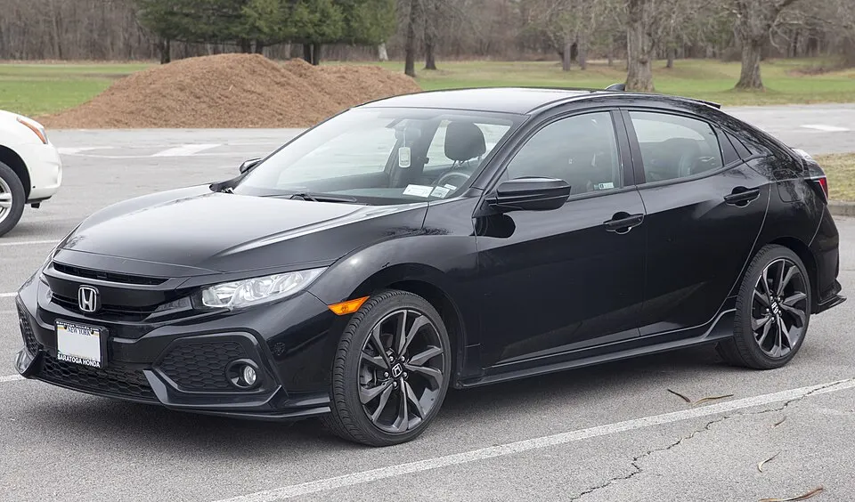 2018 Honda Civic Sport Hatchback in Crystal Black, front left, photographed in United States