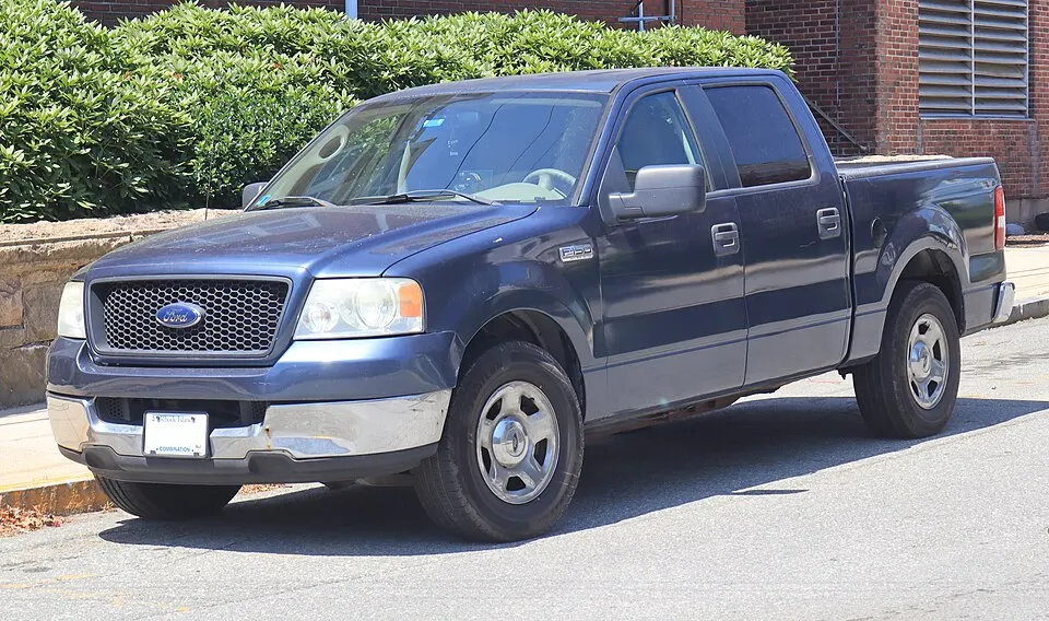 2005 Ford F-150 XLT in Medium Wedgewood Blue Metallic, front left, 07-04-2026, photographed in United States