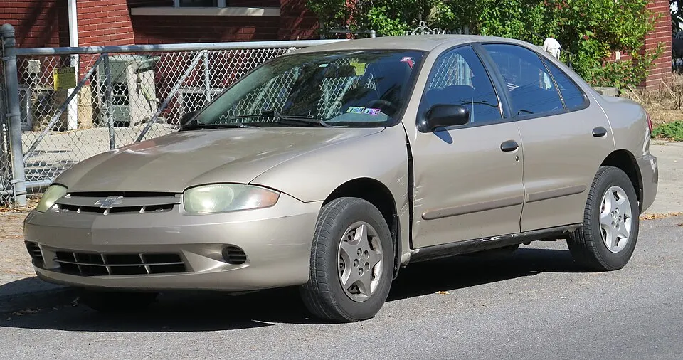 2003 Chevrolet Cavalier in Sandrift Metallic, front left, 09-20-2025, photographed in United States