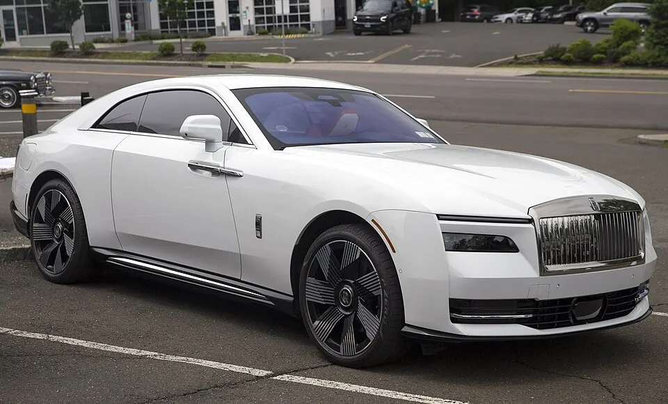 2024 Rolls-Royce Spectre in Arctic White, front right, photographed in United States
