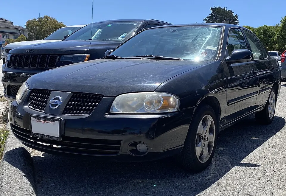 2005 Nissan Sentra 1.8S in Blackout, front left, 08-13-2022, photographed in United States