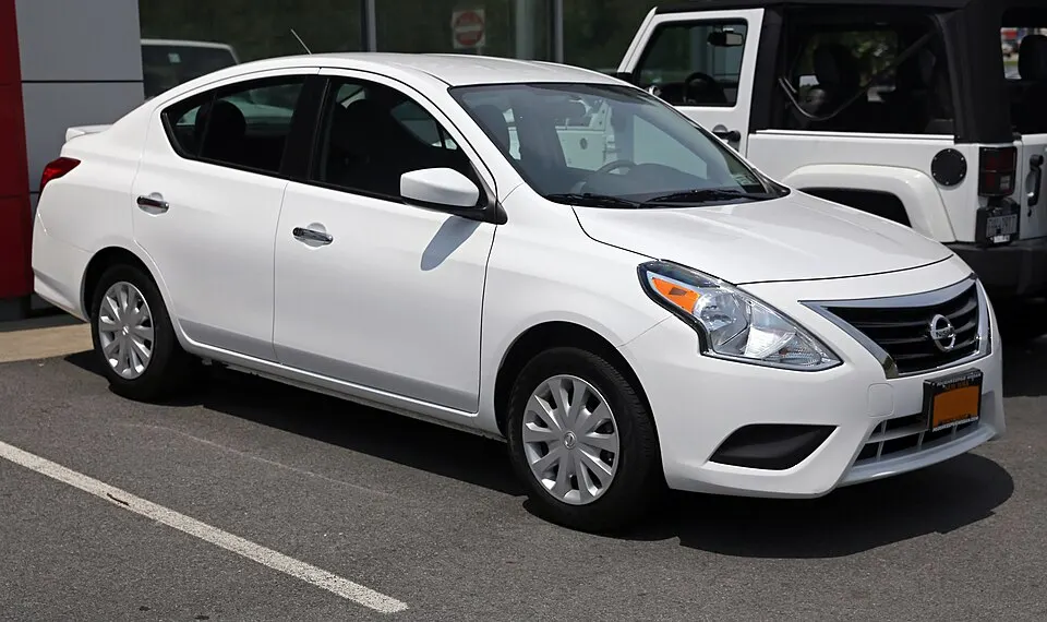 2015 Nissan Versa SV (facelift model), front right, photographed in United States