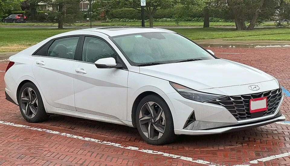 2021 Hyundai Elantra Limited in Quartz White, front right, photographed in United States