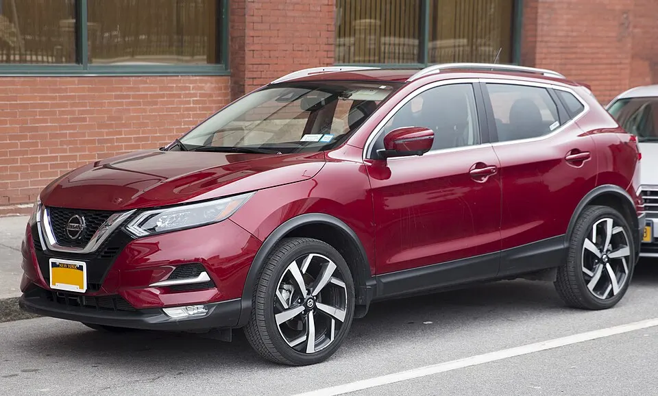 2021 Nissan Rogue Sport SL in Scarlet Ember Tintcoat, front left, photographed in United States