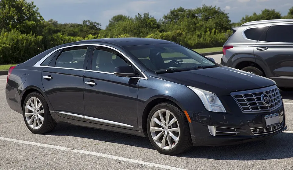 2014 Cadillac XTS Luxury in Black Diamond, front right, photographed in United States