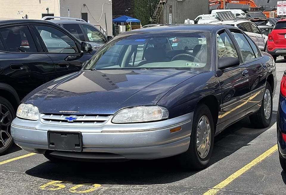 1999 Chevrolet Lumina in Navy Blue Metallic, front left, 07-02-2026, photographed in United States