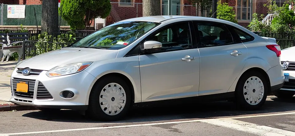 2014 Ford Focus SE sedan 2.0L, front 8.25.19, photographed in United States