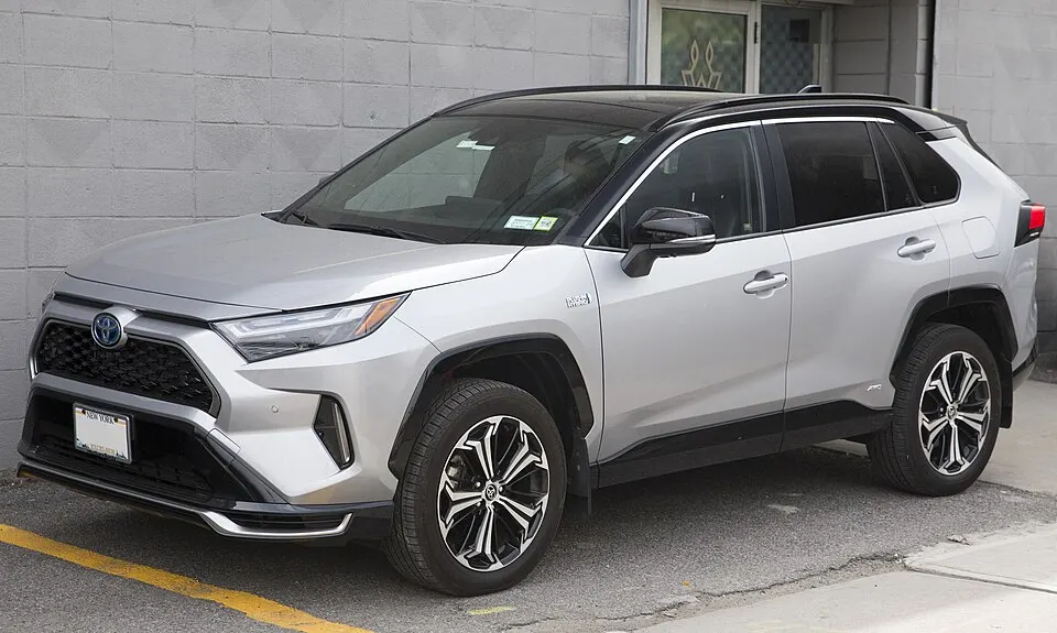 2024 Toyota RAV4 Prime XSE Premium in Silver Sky with Midnight Black roof, front left, photographed in United States
