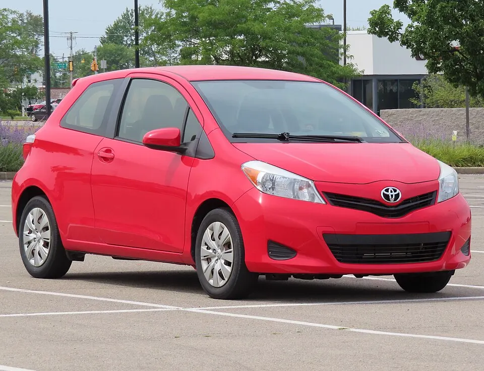2014 Toyota Yaris L 3-door, front right, 07-21-2024, photographed in United States